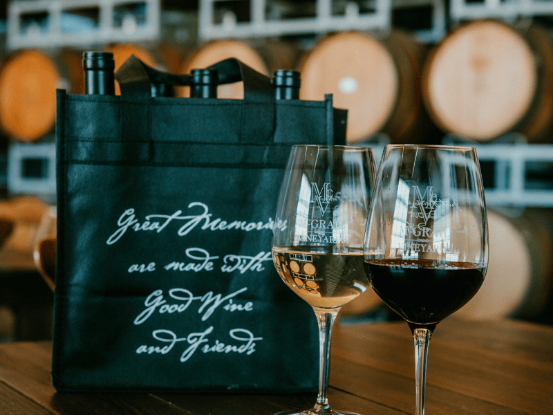 Guests enjoying a wine tasting experience at McGrail Vineyards in Livermore Valley.